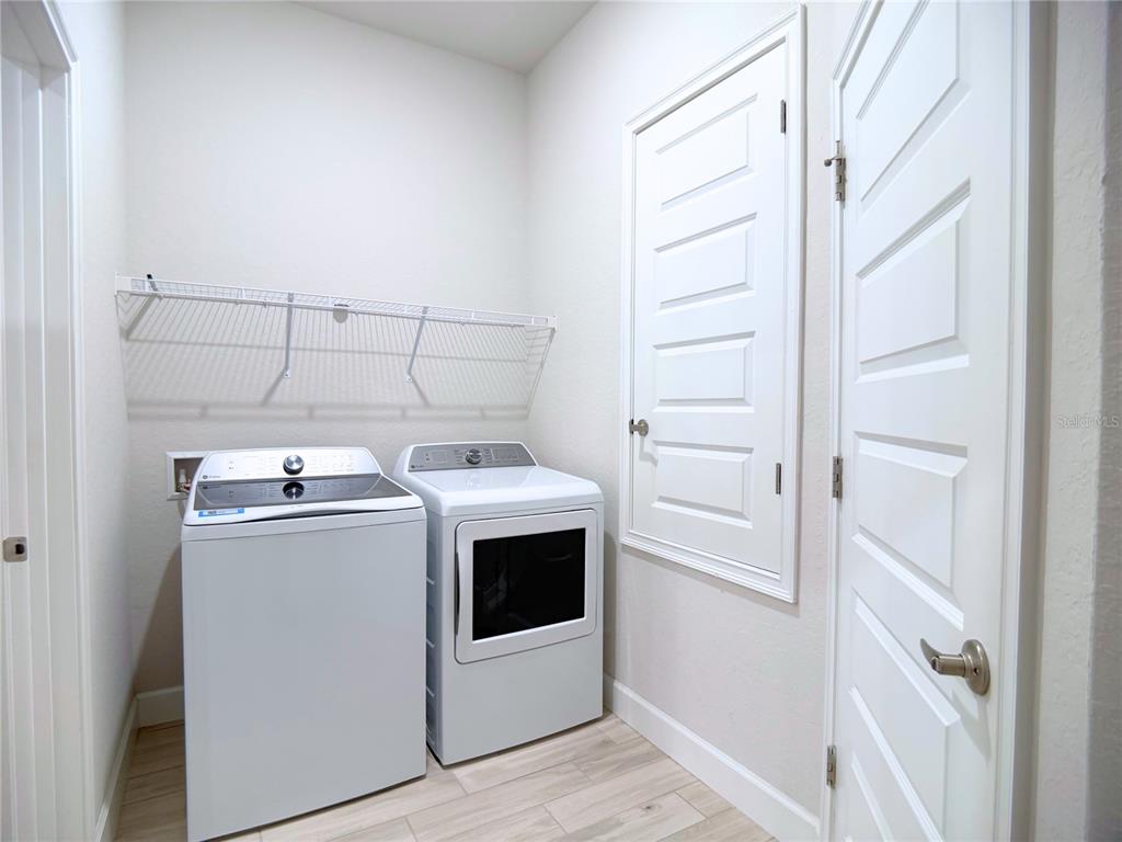 4549 Southeast 25th Loop Ocala, FL 34480 - Photo 17 of 25 a utility room with dryer and washer
