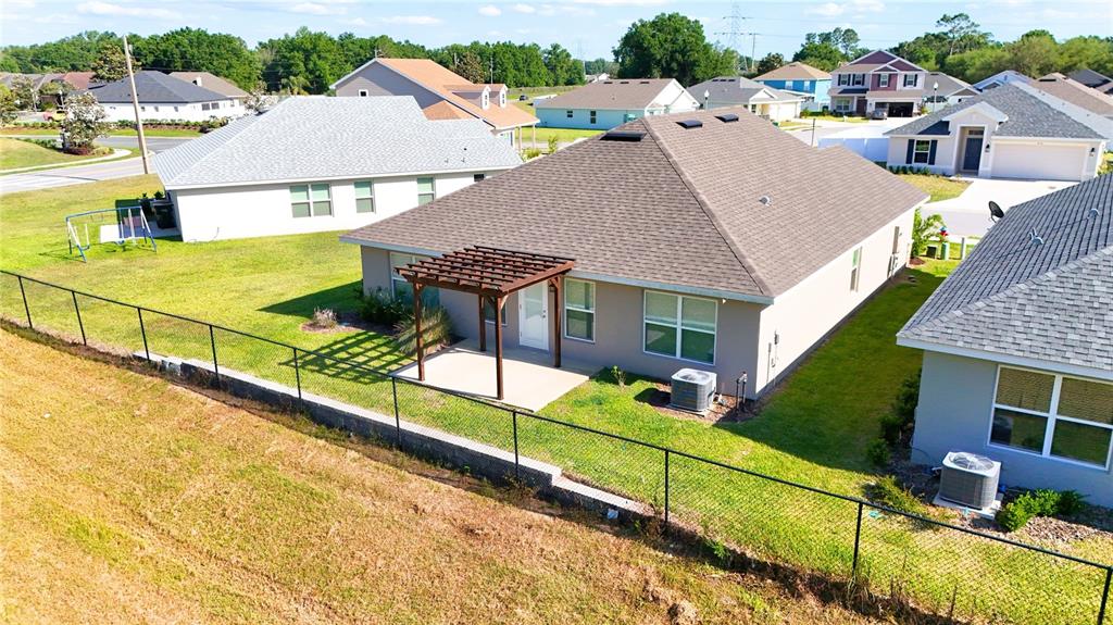 4549 Southeast 25th Loop Ocala, FL 34480 - Photo 20 of 25 a view of a house with backyard and sitting area
