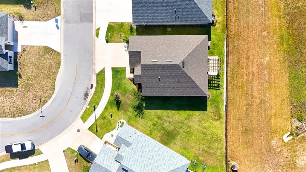4549 Southeast 25th Loop Ocala, FL 34480 - Photo 22 of 25 an aerial view of a house with swimming pool