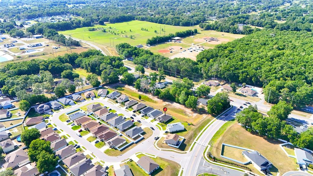 4549 Southeast 25th Loop Ocala, FL 34480 - Photo 25 of 25 an aerial view of a house with a yard and lake view