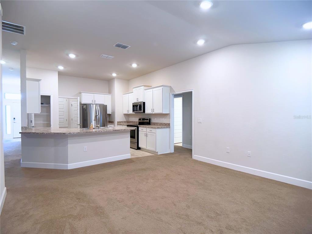 4549 Southeast 25th Loop Ocala, FL 34480 - Photo 9 of 25 a view of kitchen with refrigerator sink and microwave