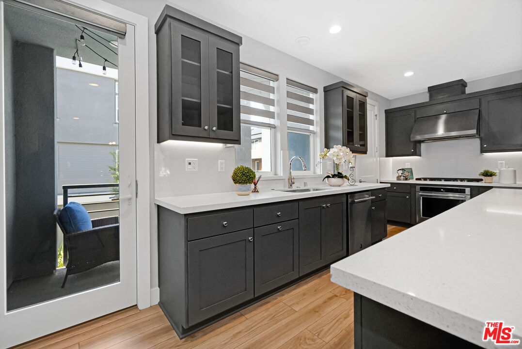 44661 Wisdom Road Fremont, CA 94538 - Photo 11 of 45 a kitchen with a sink a stove and cabinets
