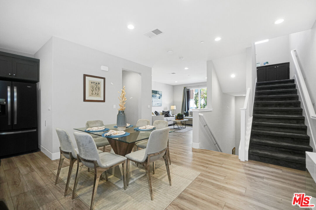 44661 Wisdom Road Fremont, CA 94538 - Photo 14 of 45 a view of a dining room with furniture and wooden floor