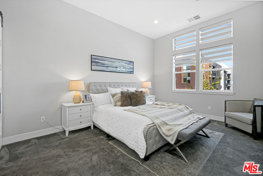 44661 Wisdom Road Fremont, CA 94538 - Photo 22 of 45 a bedroom with a bed and a couch