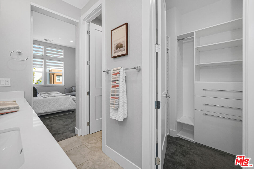 44661 Wisdom Road Fremont, CA 94538 - Photo 26 of 45 a bathroom with a tub shower and a sink