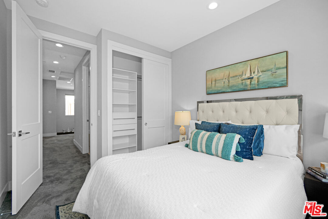 44661 Wisdom Road Fremont, CA 94538 - Photo 28 of 45 a bedroom with a bed and a painting on the wall