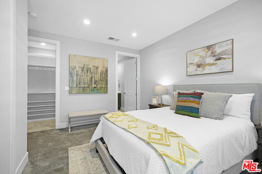 44661 Wisdom Road Fremont, CA 94538 - Photo 30 of 45 a bedroom with a bed and a painting on the wall