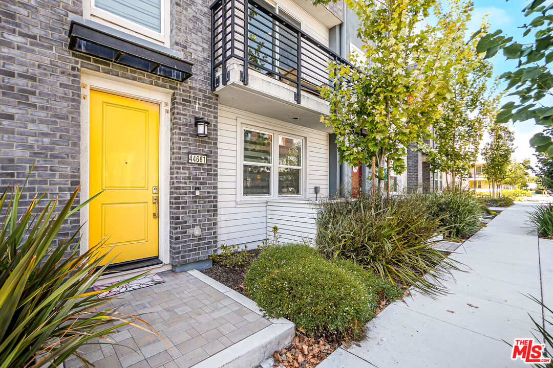 44661 Wisdom Road Fremont, CA 94538 - Photo 3 of 45 a view of a house with a small yard and potted plants