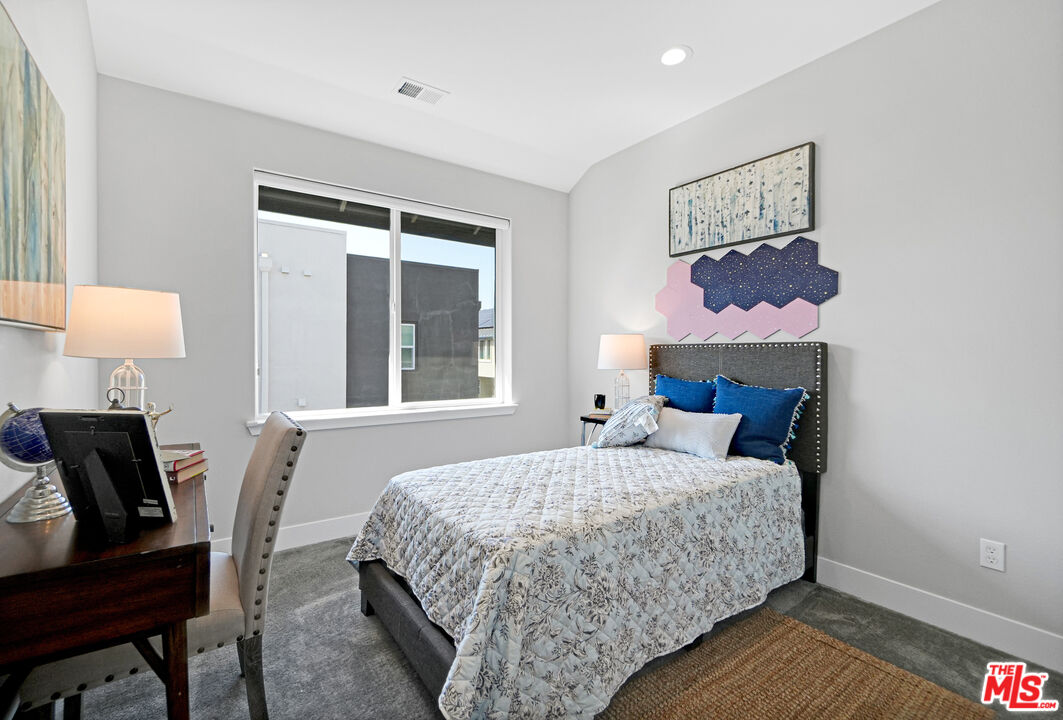 44661 Wisdom Road Fremont, CA 94538 - Photo 33 of 45 a bedroom with a bed and wooden floor