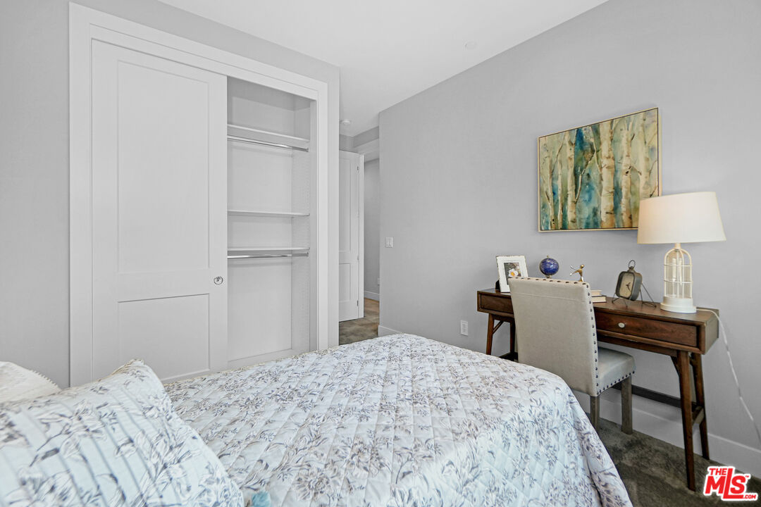 44661 Wisdom Road Fremont, CA 94538 - Photo 34 of 45 a bedroom with a bed and a table in it