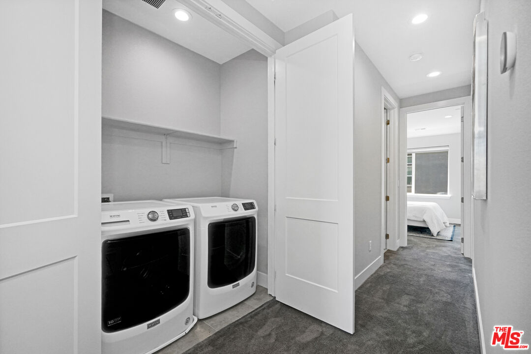 44661 Wisdom Road Fremont, CA 94538 - Photo 36 of 45 a view of a hallway with washer and dryer