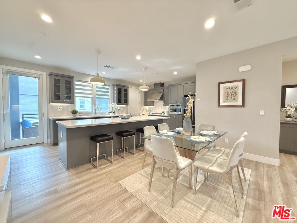 44661 Wisdom Road Fremont, CA 94538 - Photo 6 of 45 a view of a dining room with furniture window and wooden floor