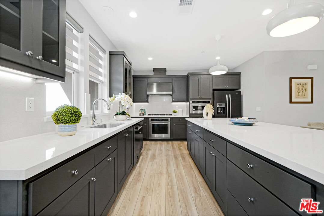 44661 Wisdom Road Fremont, CA 94538 - Photo 8 of 45 a kitchen with kitchen island granite countertop lots of counter top space