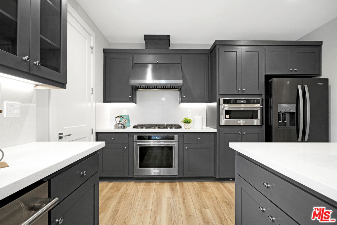44661 Wisdom Road Fremont, CA 94538 - Photo 10 of 45 a kitchen with stainless steel appliances a sink stove and refrigerator