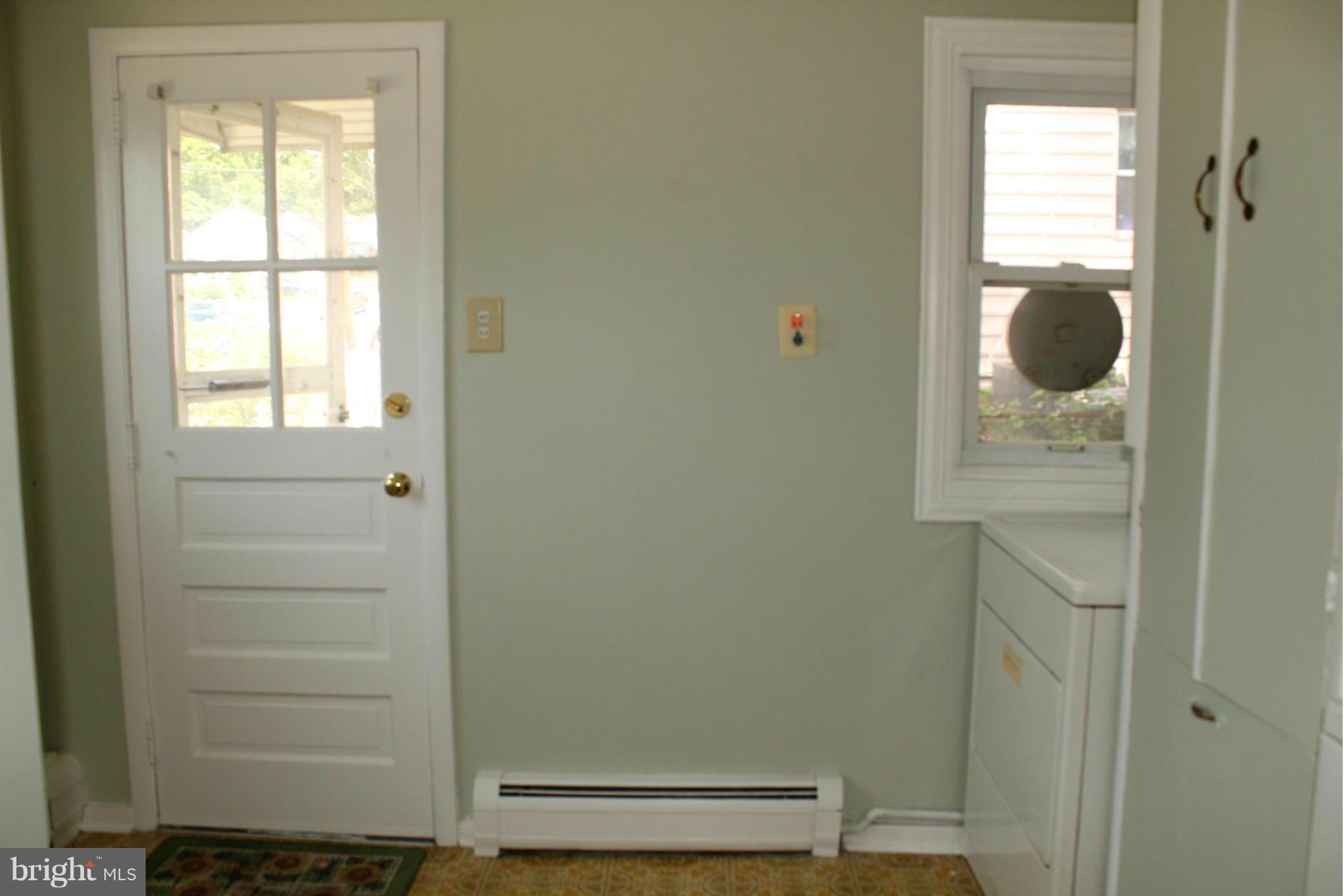 7726 Garrison Road Hyattsville, MD 20784 - Photo 18 of 25 Nice neutral color in Laundry Room with exit