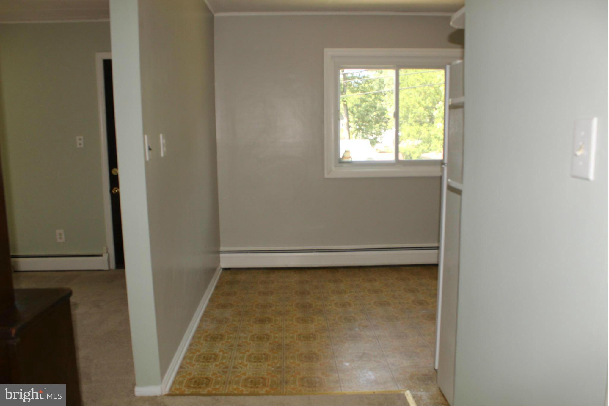 7726 Garrison Road Hyattsville, MD 20784 - Photo 23 of 25 Kitchen has laminate flooring