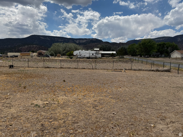 210 South State Street Moroni, UT 84646 - Photo 22 of 23 Expansive open lot with wire fencing