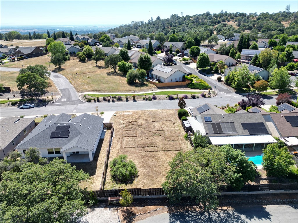 205 Lariat Loop Oroville, CA 95966 - Photo 4 of 8 an aerial view of multiple houses with yard