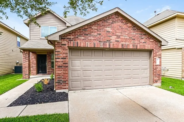 a view of house with garage