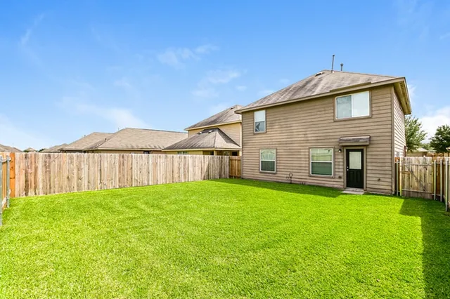 a view of a backyard of the house