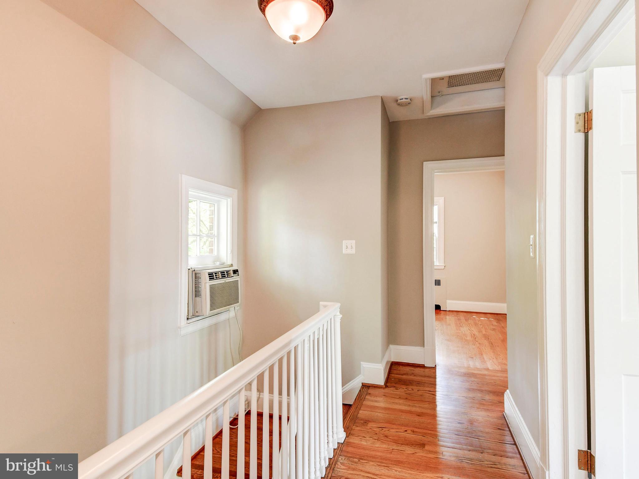 323 Taplow Road Baltimore, MD 21212 - Photo 23 of 41 Upstairs Hallway with Hardwood Flooring