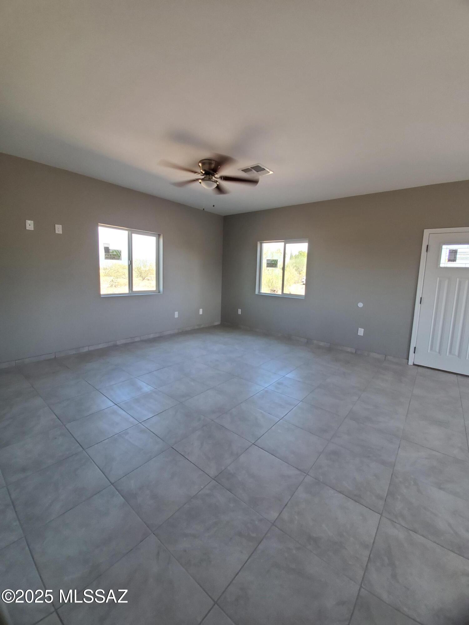 1885 Via Ochoa Rio Rico, AZ 85648 - Photo 6 of 11 a view of an empty room with a window