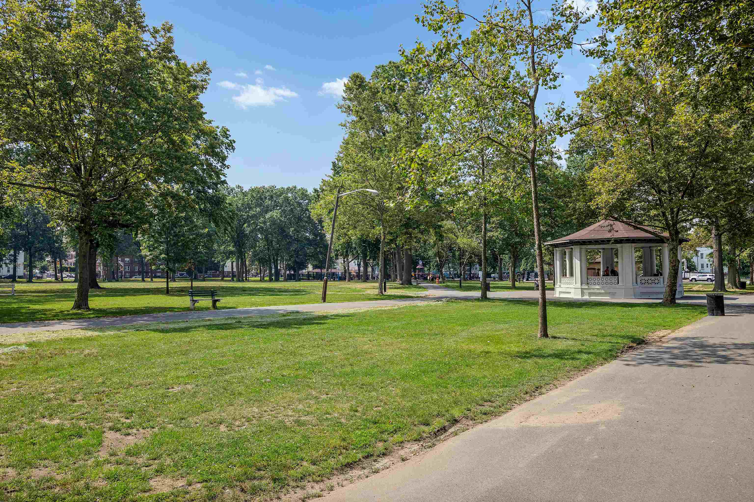 277 Harrison Avenue, Unit E6 Jersey City, NJ 07304 - Photo 13 of 14 a view of a big yard with a house in the background