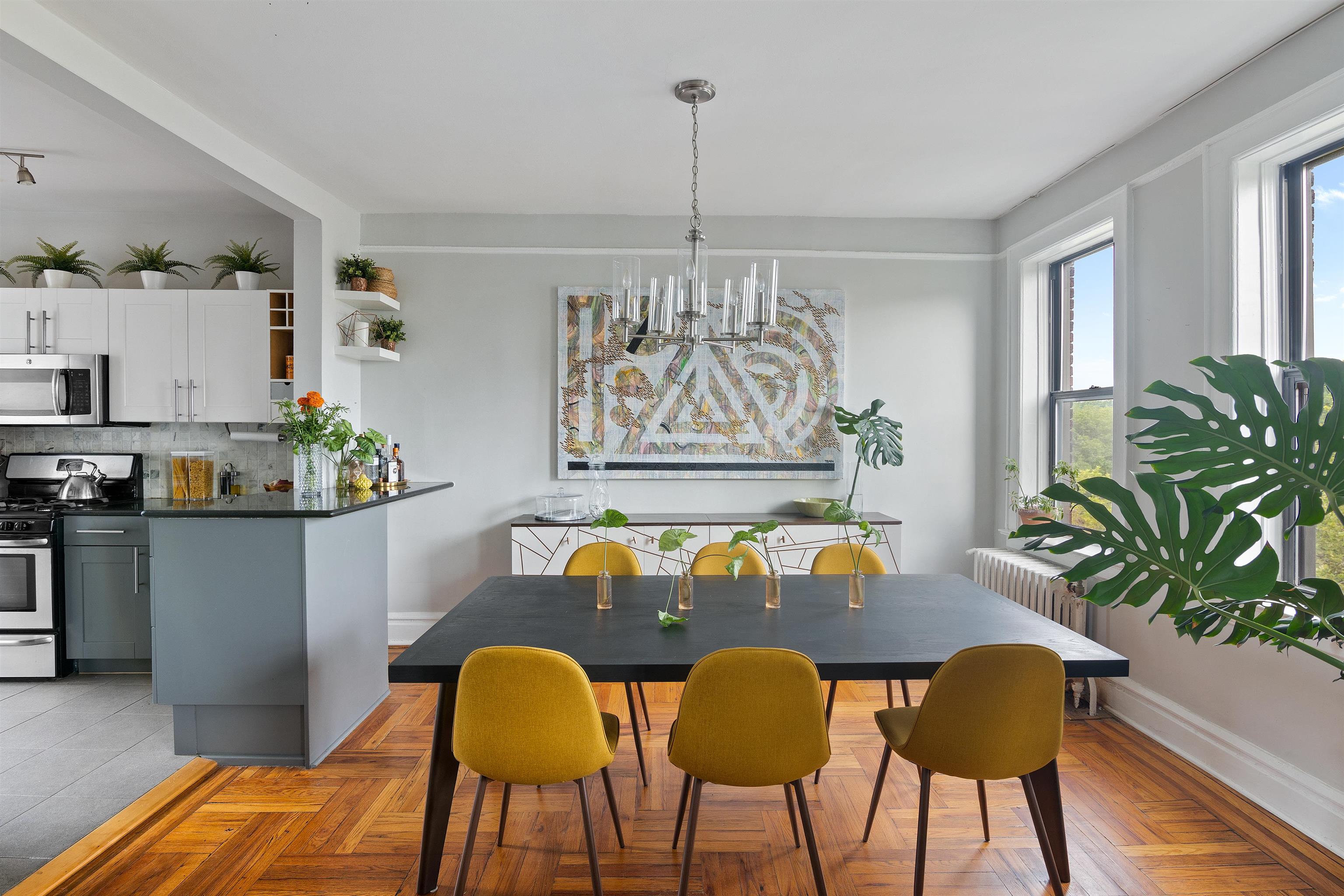 277 Harrison Avenue, Unit E6 Jersey City, NJ 07304 - Photo 2 of 14 a living room with furniture and a chandelier