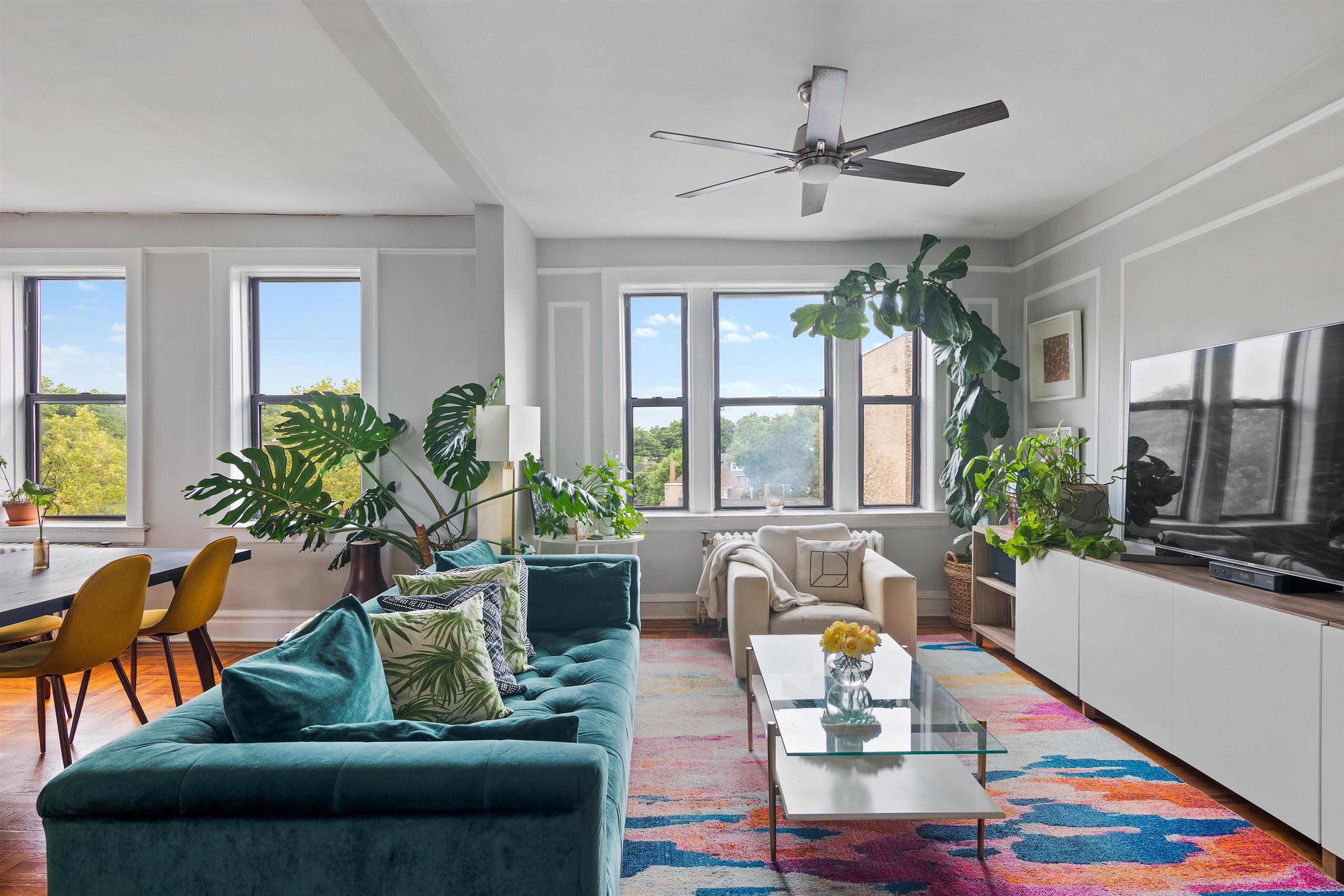 277 Harrison Avenue, Unit E6 Jersey City, NJ 07304 - Photo 3 of 14 a living room with furniture fireplace and flat screen tv
