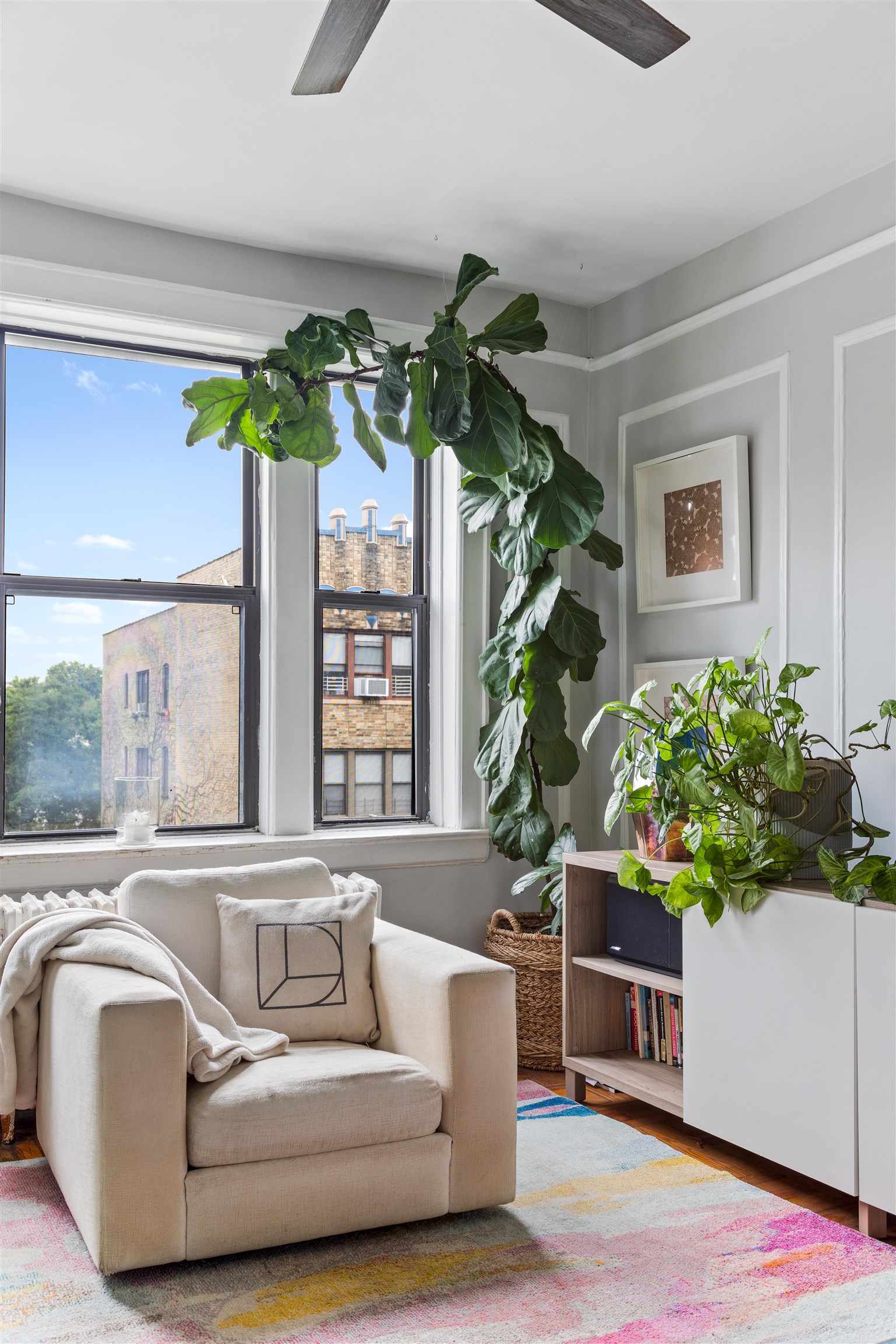 277 Harrison Avenue, Unit E6 Jersey City, NJ 07304 - Photo 7 of 14 a living room with furniture and a potted plant