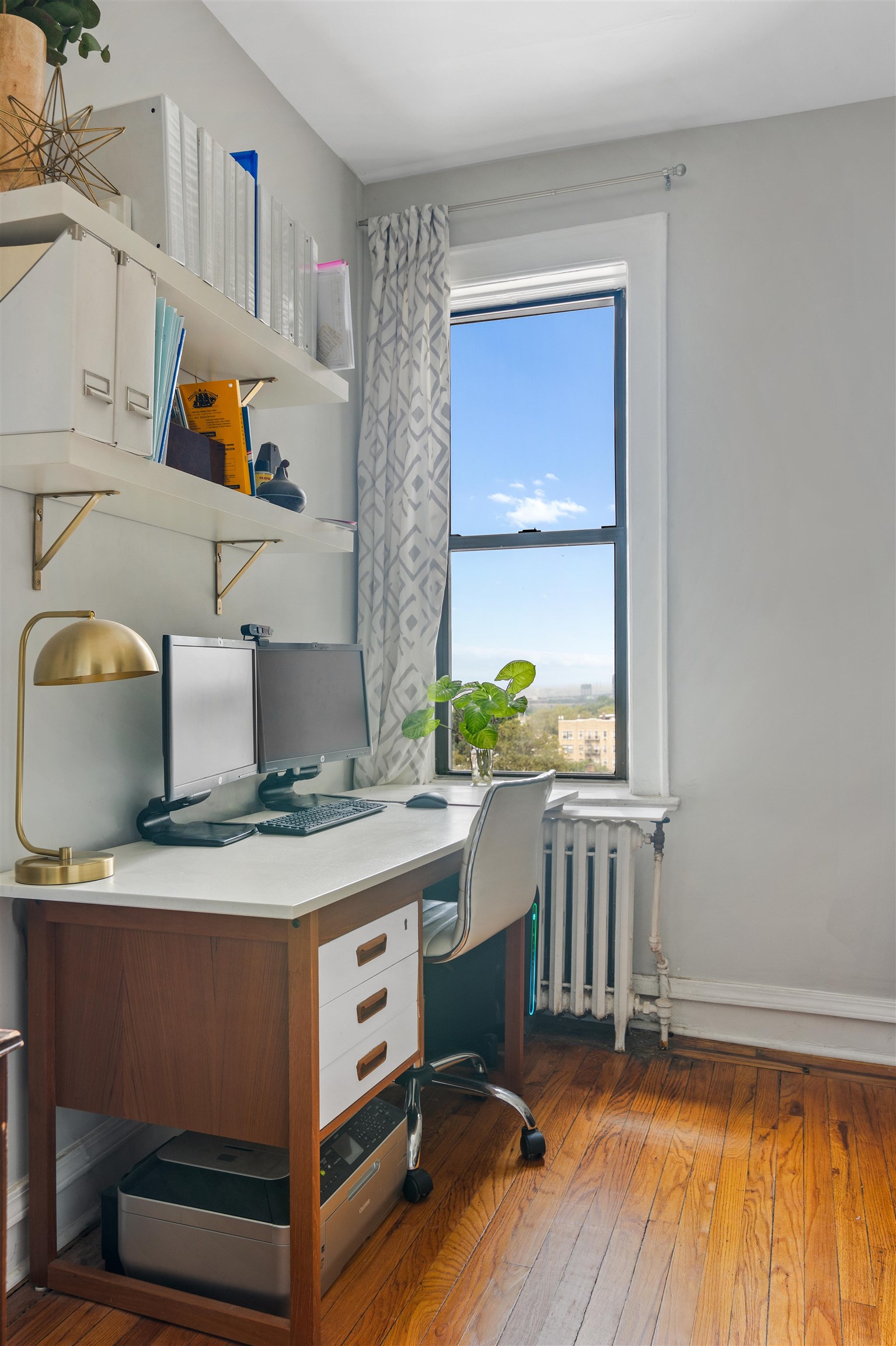 277 Harrison Avenue, Unit E6 Jersey City, NJ 07304 - Photo 10 of 14 a room with cabinets and wooden floor