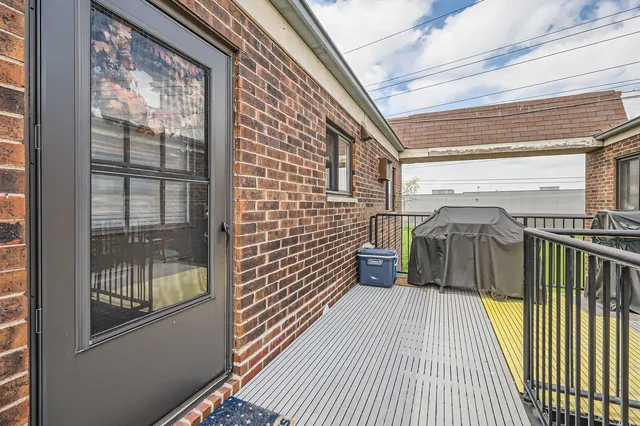 a view of a balcony with floor to ceiling window