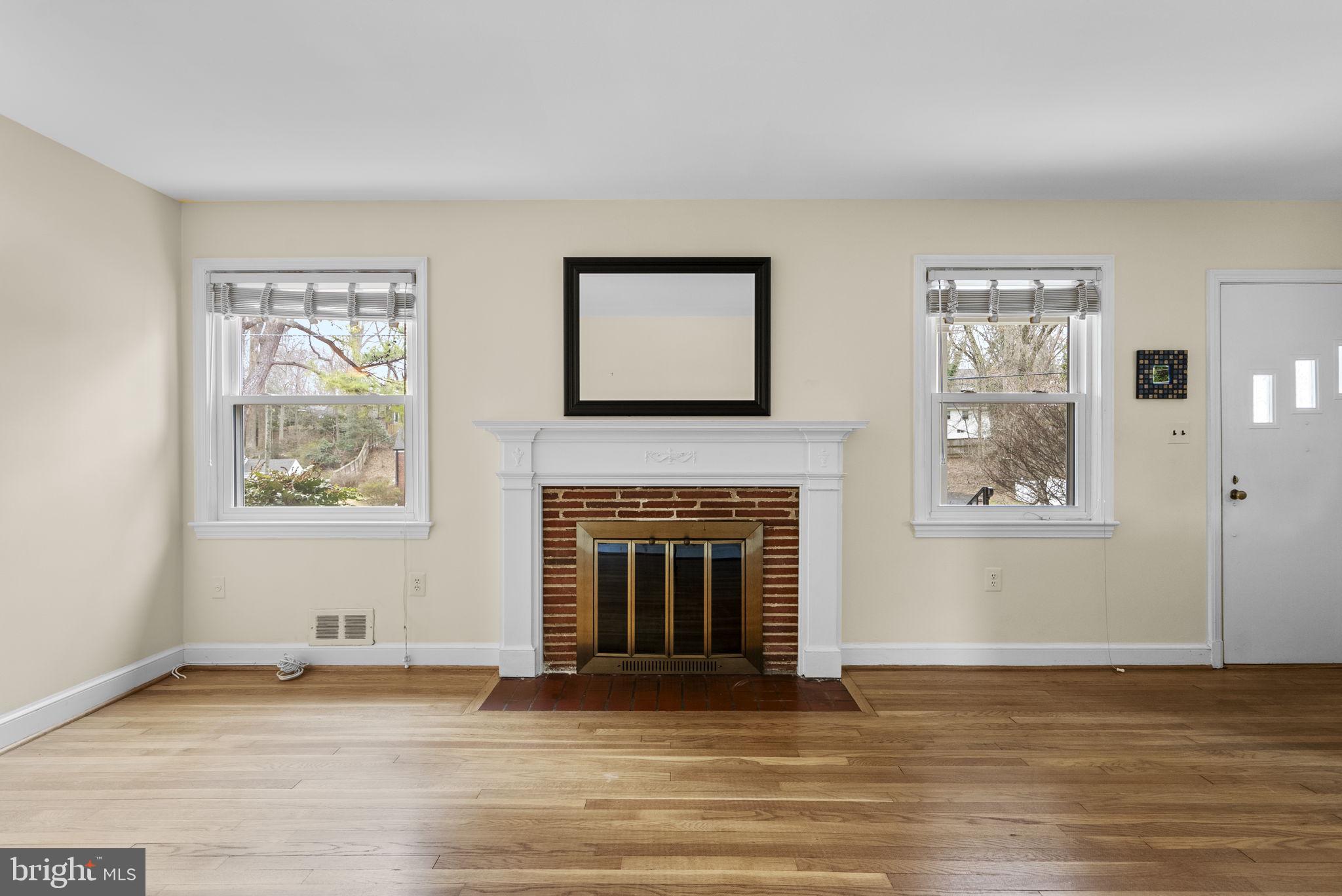 414 Hillmoor Drive Silver Spring, MD 20901 - Photo 13 of 49 a view of an empty room with window and fire place