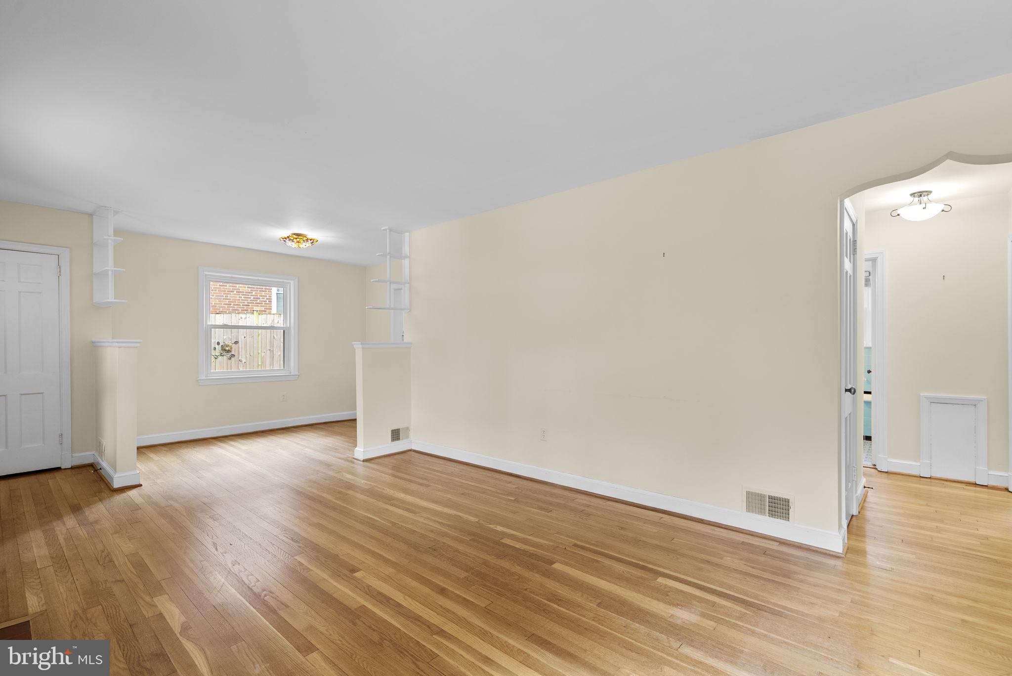414 Hillmoor Drive Silver Spring, MD 20901 - Photo 15 of 49 an empty room with wooden floor and mirror