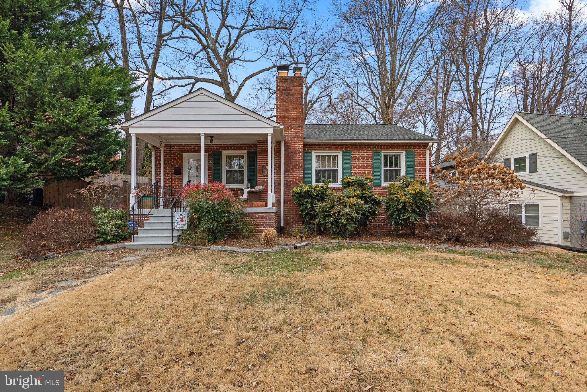 414 Hillmoor Drive Silver Spring, MD 20901 - Photo 2 of 49 front view of a house with a garden