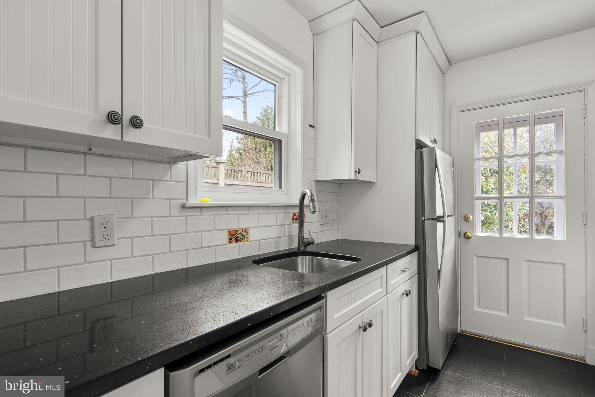 414 Hillmoor Drive Silver Spring, MD 20901 - Photo 23 of 49 a kitchen with a sink and cabinets