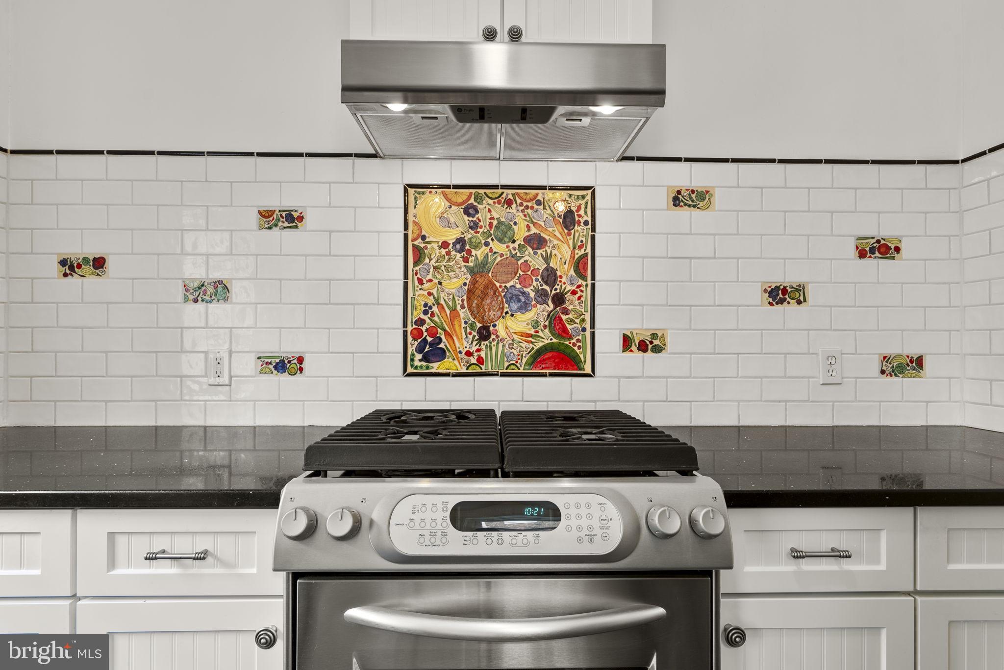 414 Hillmoor Drive Silver Spring, MD 20901 - Photo 25 of 49 a stove top oven sitting inside of a kitchen