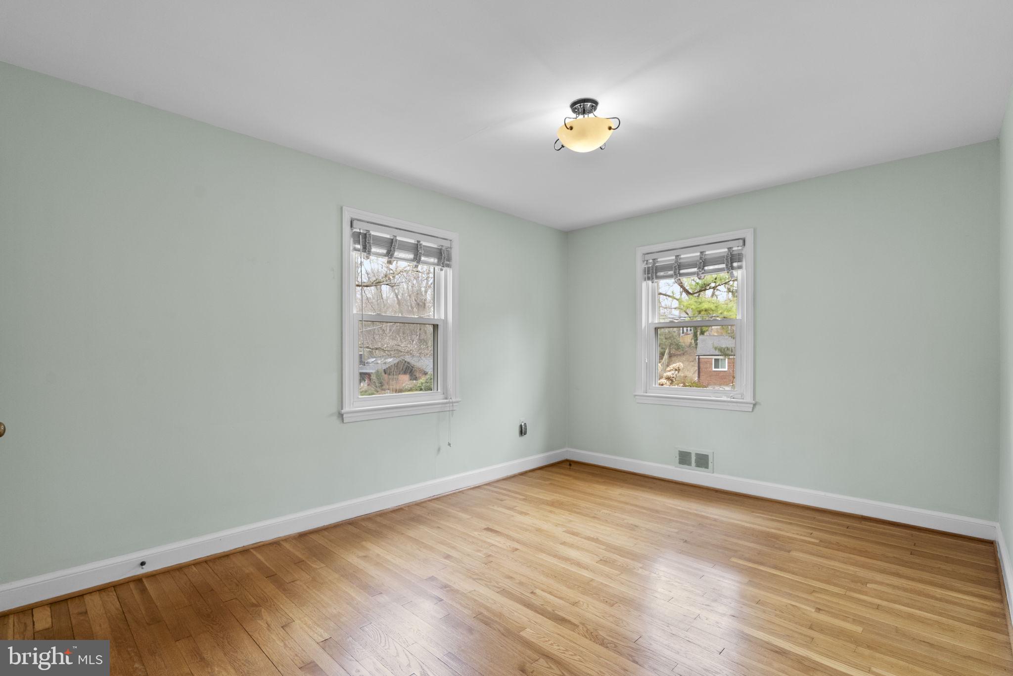 414 Hillmoor Drive Silver Spring, MD 20901 - Photo 26 of 49 wooden floor in an empty room with a window