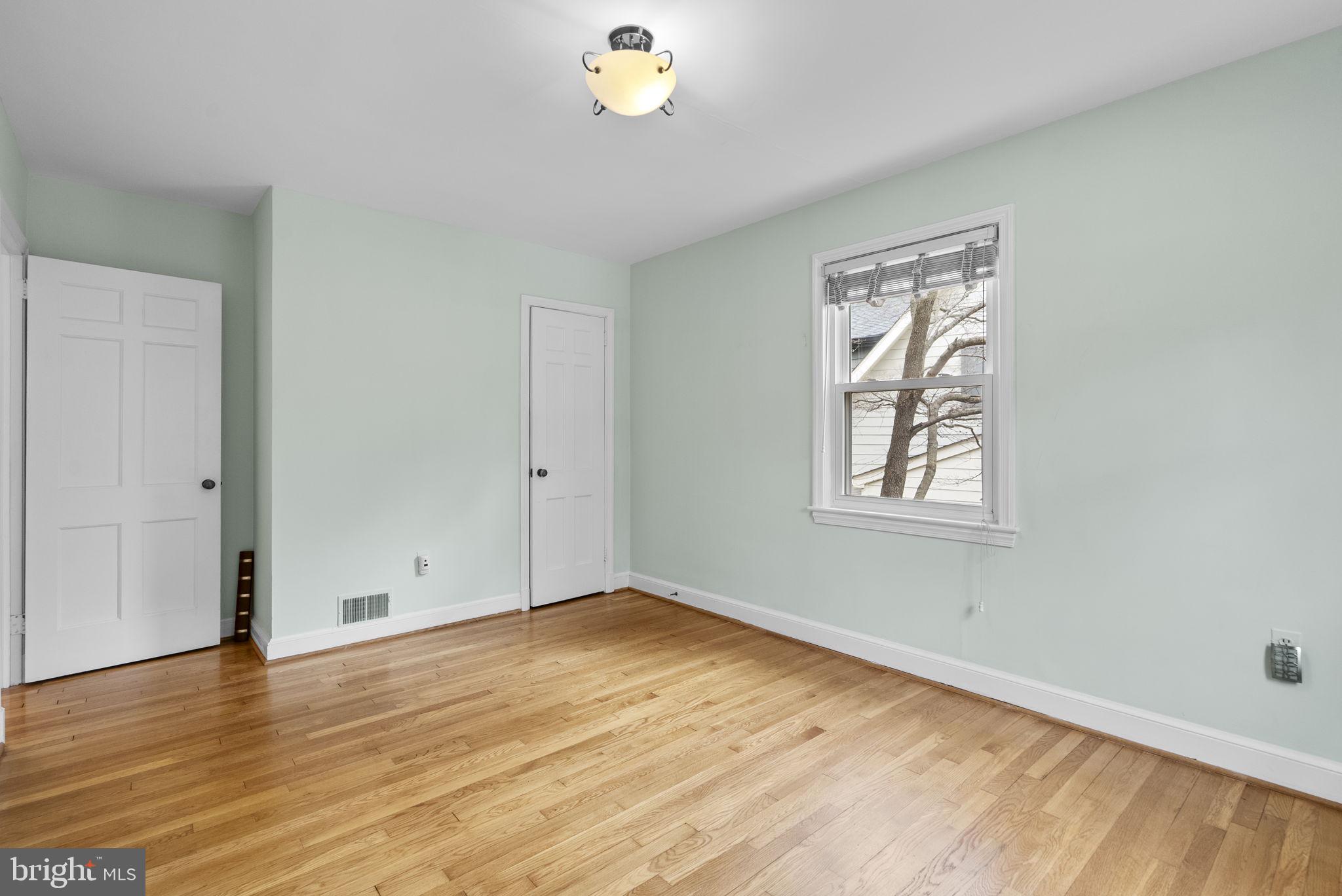 414 Hillmoor Drive Silver Spring, MD 20901 - Photo 30 of 49 wooden floor in an empty room with a window