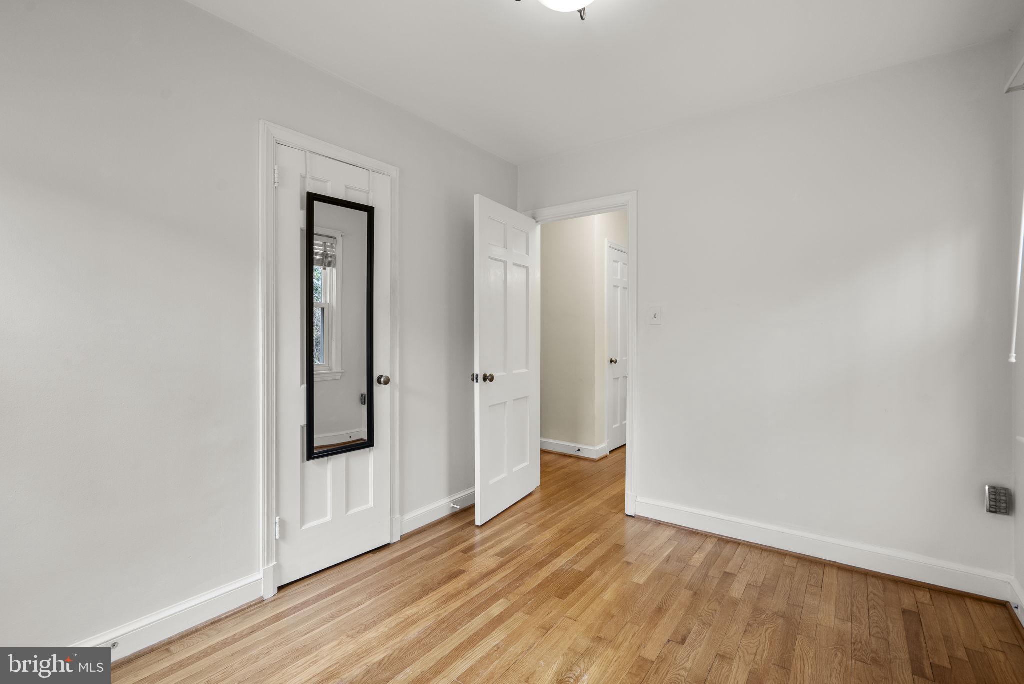 414 Hillmoor Drive Silver Spring, MD 20901 - Photo 33 of 49 a view of wooden floor in an empty room