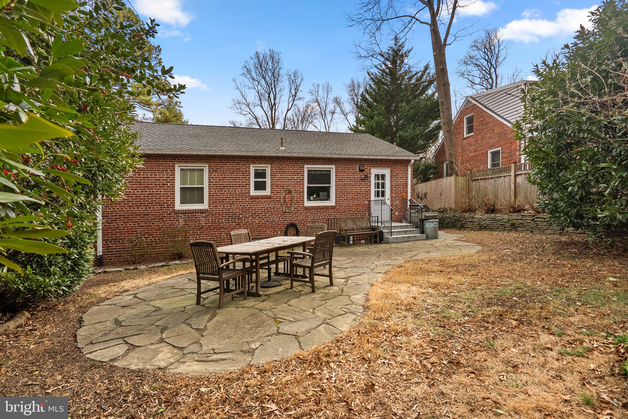 414 Hillmoor Drive Silver Spring, MD 20901 - Photo 4 of 49 a backyard of a house with yard and outdoor seating
