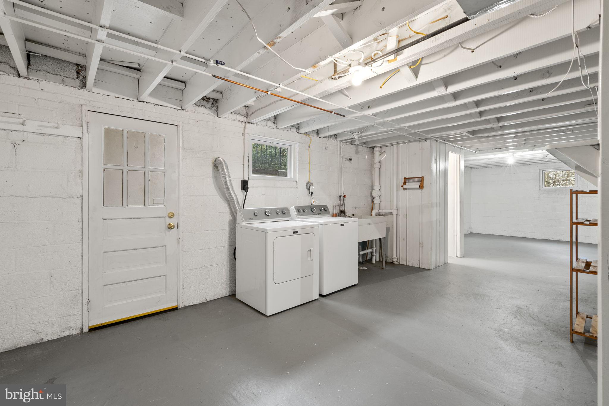 414 Hillmoor Drive Silver Spring, MD 20901 - Photo 45 of 49 a utility room with dryer and washer