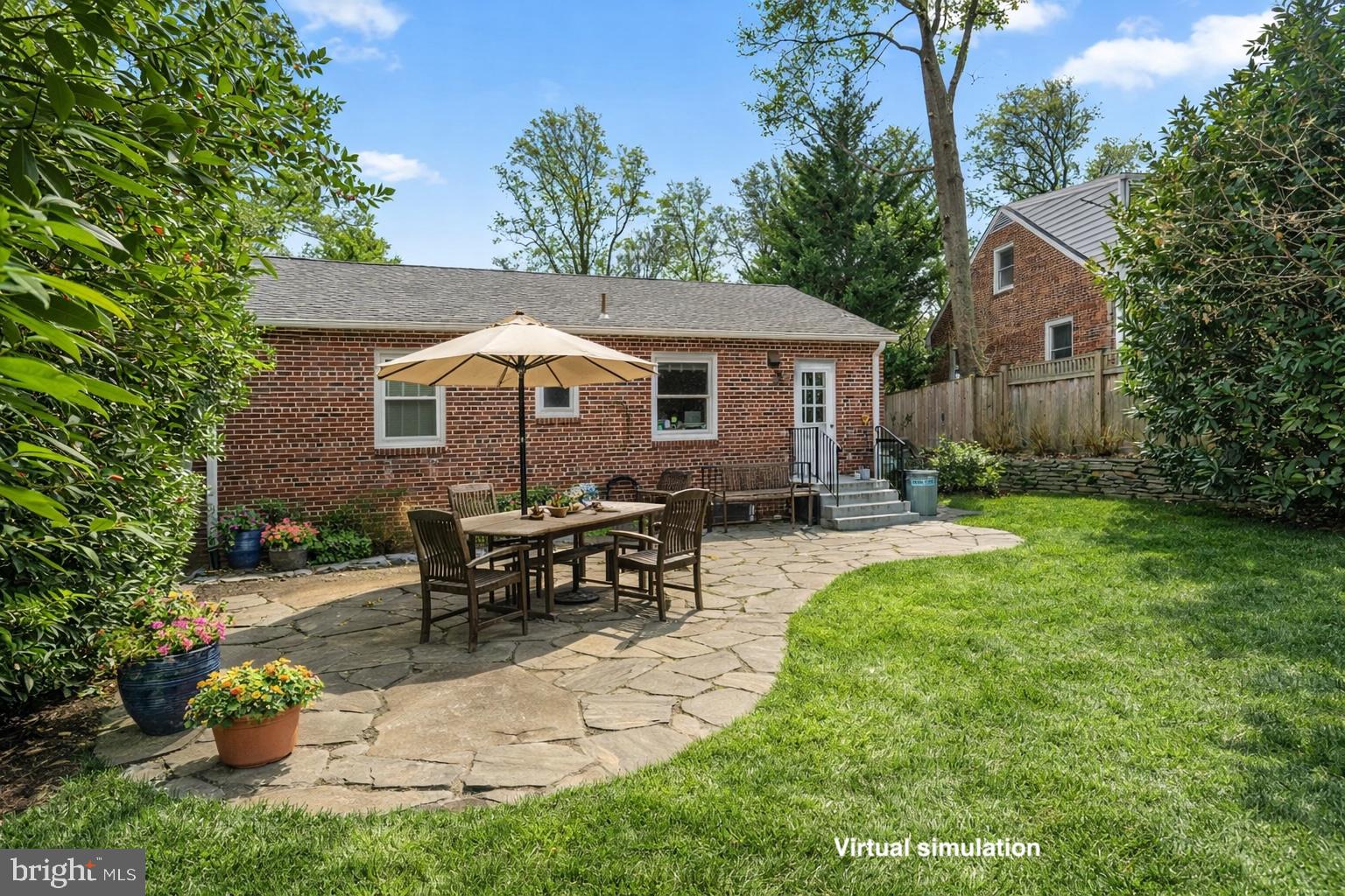 414 Hillmoor Drive Silver Spring, MD 20901 - Photo 5 of 49 a view of a house with backyard sitting area and garden