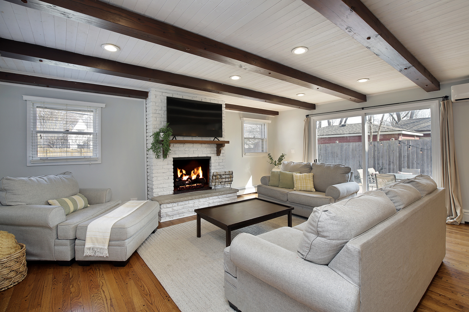 2132 Illinois Road Northbrook, IL 60062 - Photo 11 of 26 a living room with furniture and a fireplace