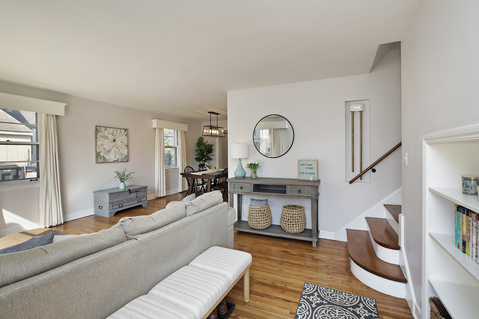 2132 Illinois Road Northbrook, IL 60062 - Photo 5 of 26 a living room with furniture a fireplace a rug and a window