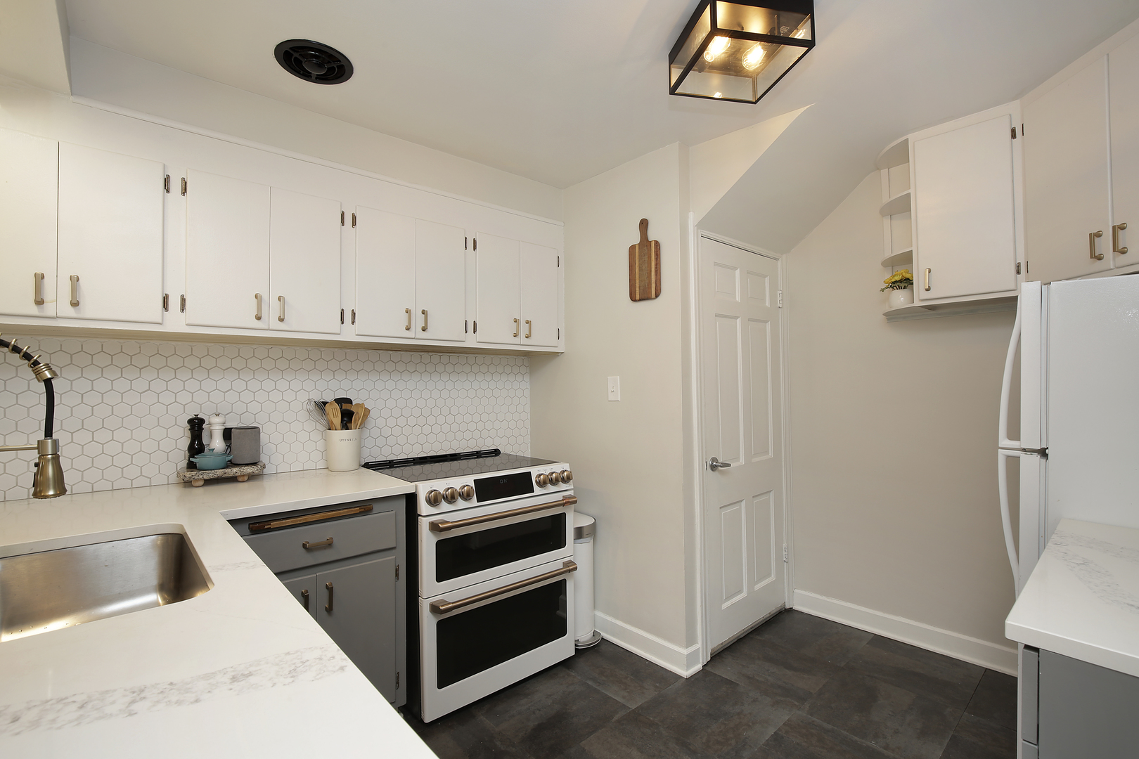 2132 Illinois Road Northbrook, IL 60062 - Photo 9 of 26 a view of a kitchen with sink dishwasher and a refrigerator