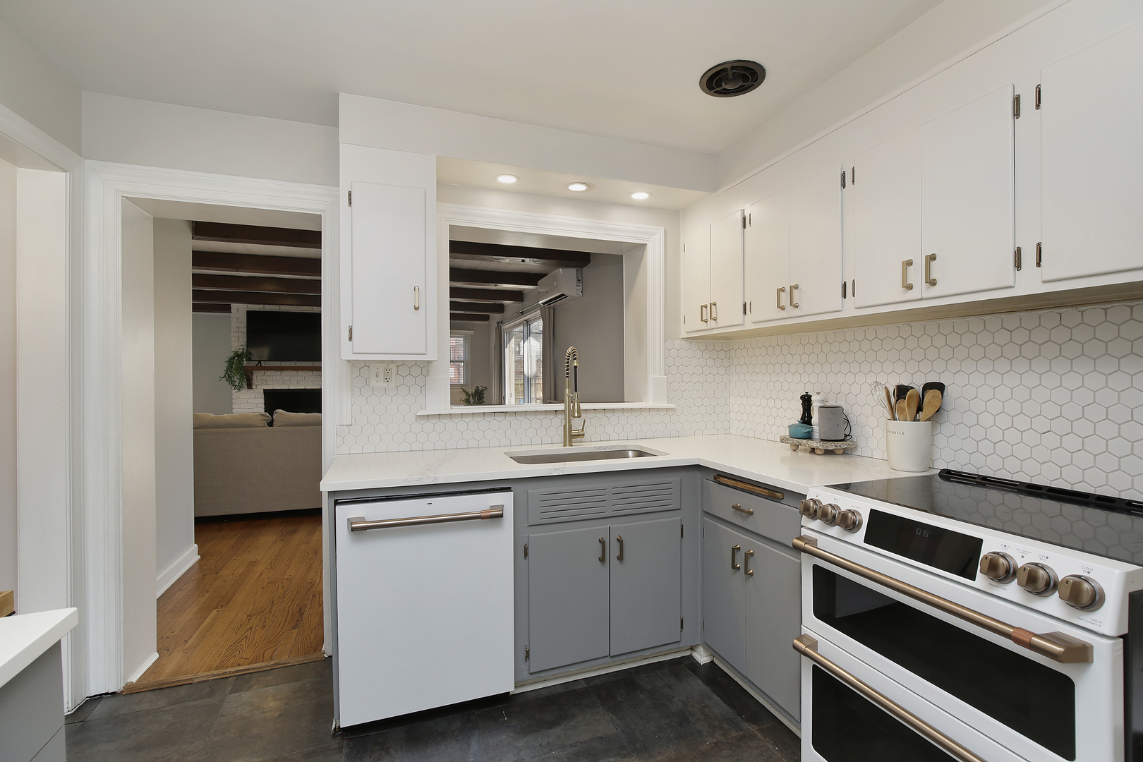 2132 Illinois Road Northbrook, IL 60062 - Photo 10 of 26 a kitchen with a sink stainless steel appliances and cabinets