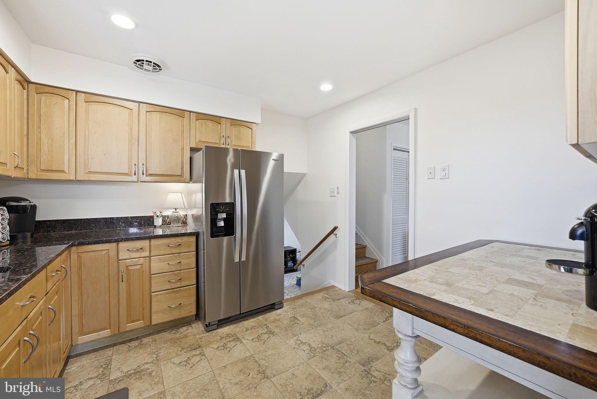 4616 Exeter Street Annandale, VA 22003 - Photo 13 of 36 a kitchen with stainless steel appliances granite countertop a refrigerator and a stove top oven