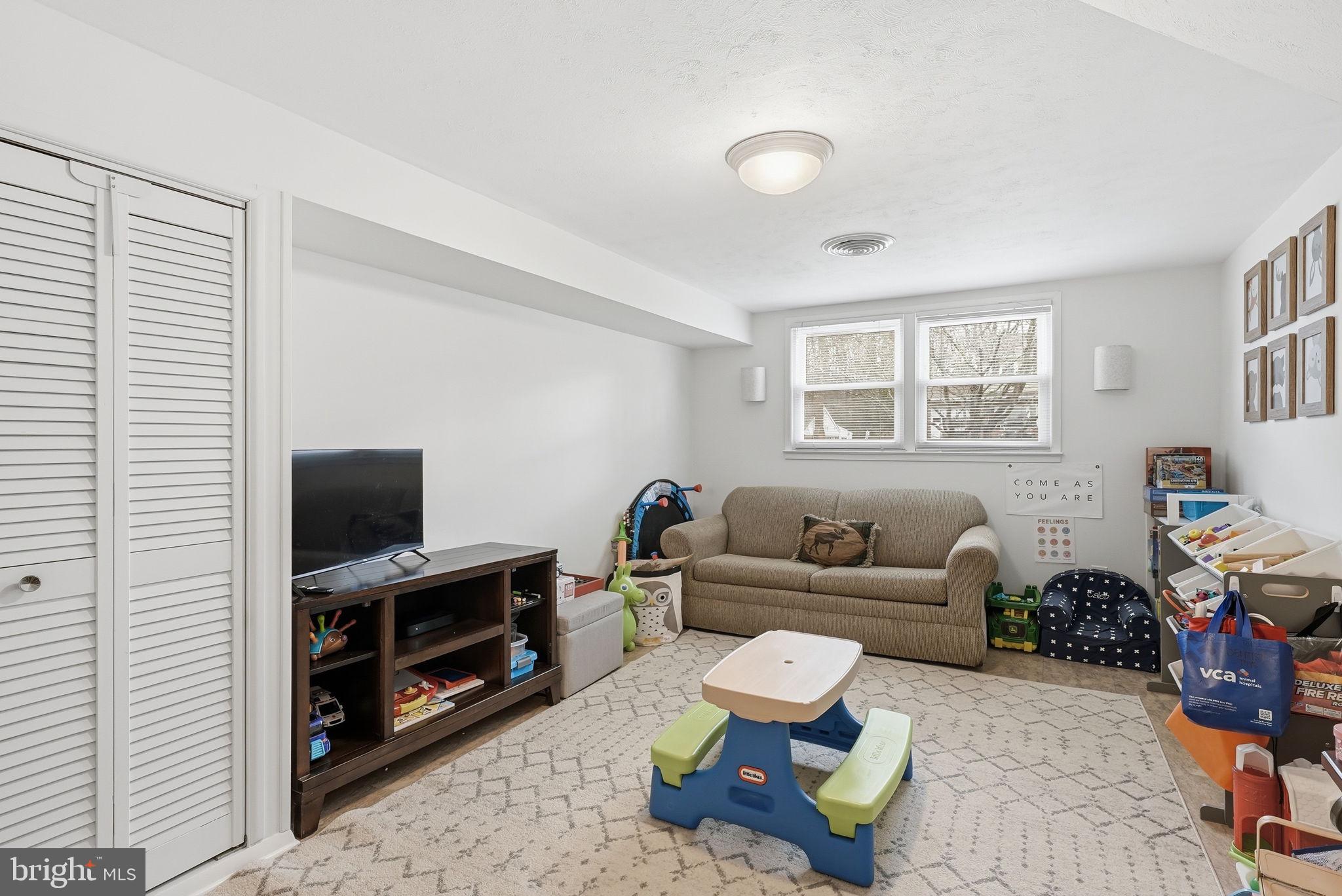 4616 Exeter Street Annandale, VA 22003 - Photo 20 of 36 a living room with furniture and a flat screen tv