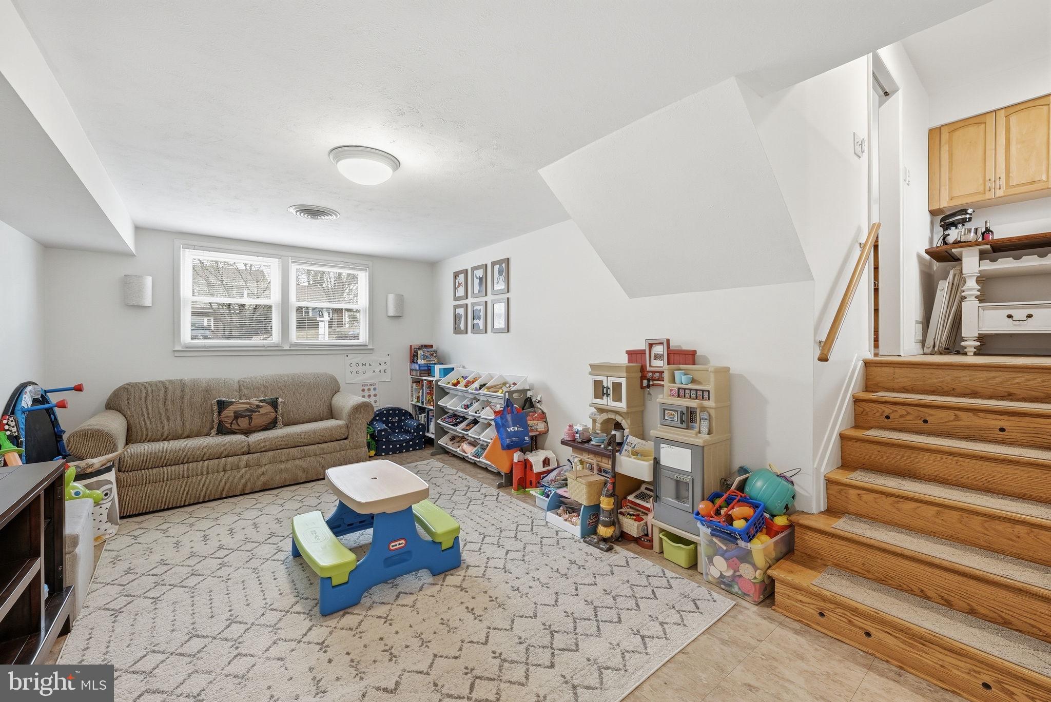 4616 Exeter Street Annandale, VA 22003 - Photo 21 of 36 a living room with furniture and wooden floor